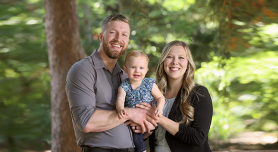 Rylan and Haley Willis post with their toddler, Savannah.